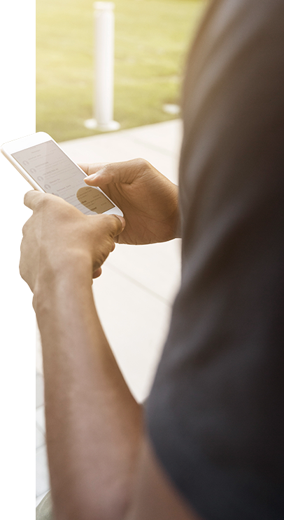 A person can be seen searching their contacts folder on their smart mobile device